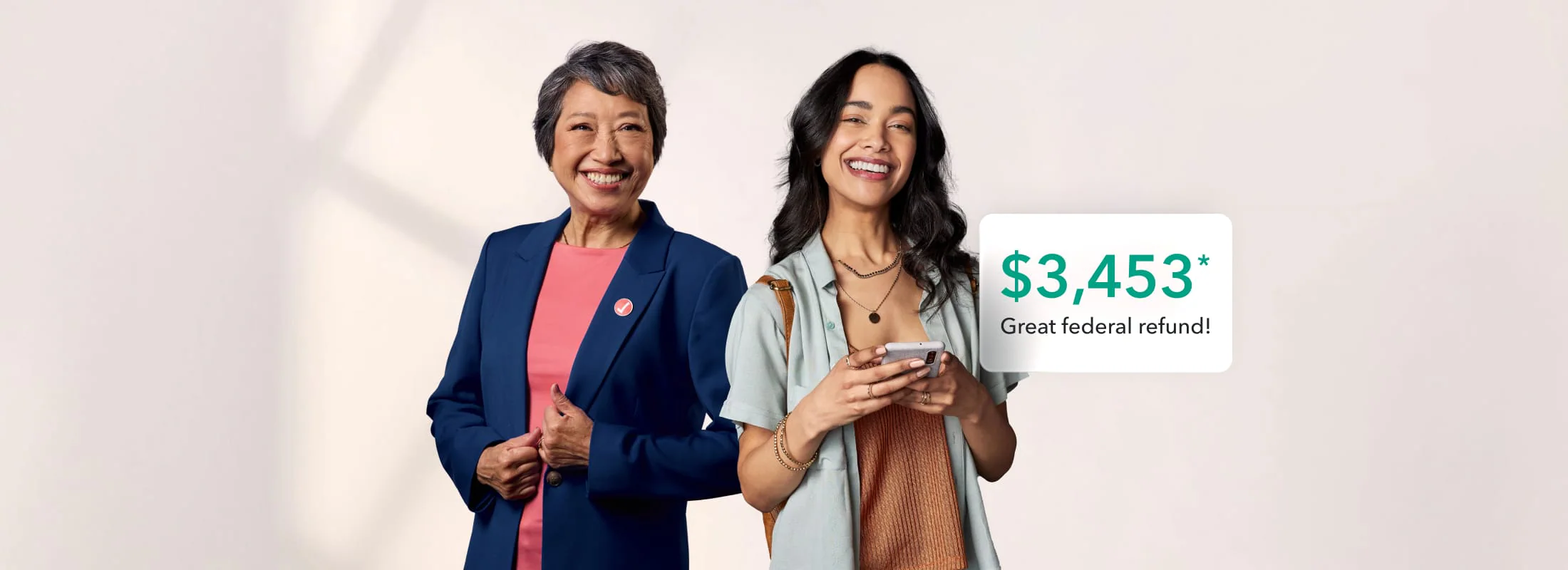 A tax expert and TurboTax customer celebrate a federal tax refund of $3,453