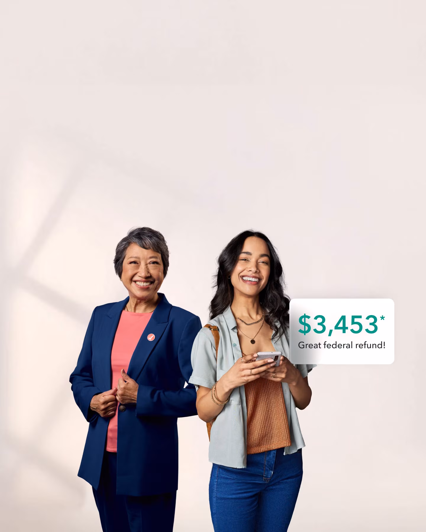 A tax expert and TurboTax customer celebrate a federal tax refund of $3,453